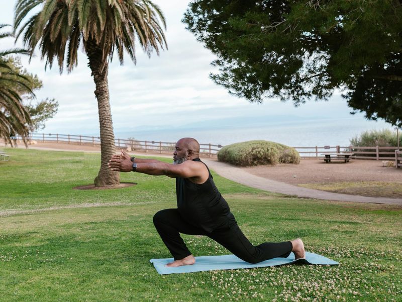 A person gently stretching in a yoga pose, symbolizing a beginner's journey.