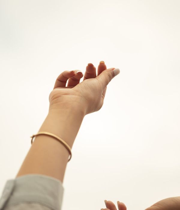 Woman in a graceful yoga pose with subtle musical notes in the background, bathed in soft light.